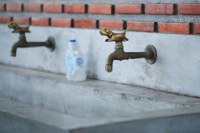 Close-up of faucet on wall