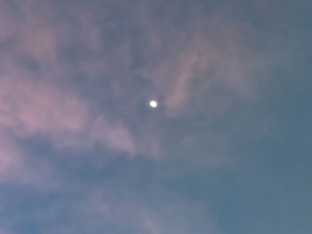 Low angle view of moon against sky at night