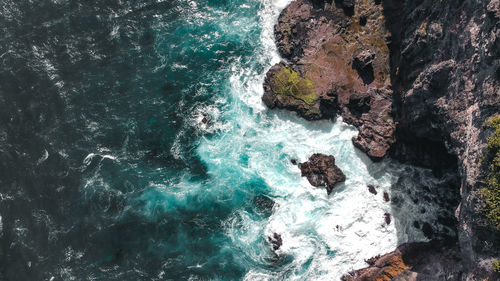 High angle view of rock formation in sea