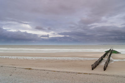 Scenic view of beach against sky