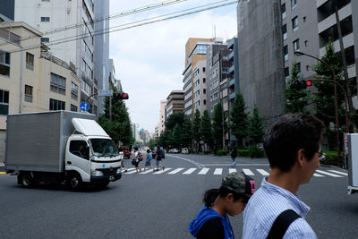 Vehicles on road along buildings