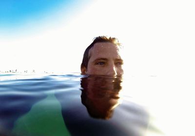 Portrait of man swimming in sea