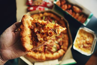 Close-up of hand holding meat