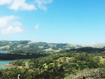 Scenic view of mountains against blue sky