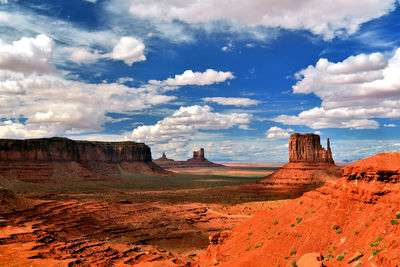 Monument valley against cloudy sky