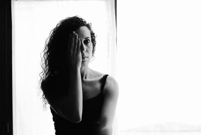 Woman standing in front of window