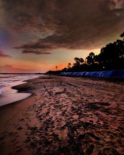 Scenic view of beach against sky during sunset