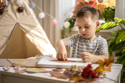 Portrait of cute girl studying at home