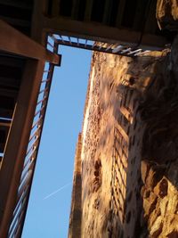 Low angle view of building against clear blue sky