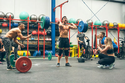 Man celebrating he is the champion of a weightlifting tournament