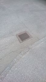 High angle view of manhole on street