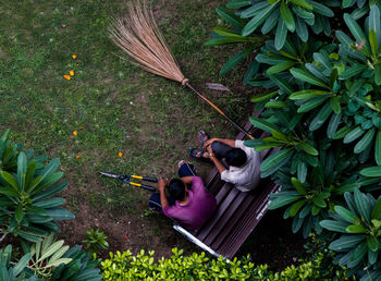 High angle view of men sitting in park