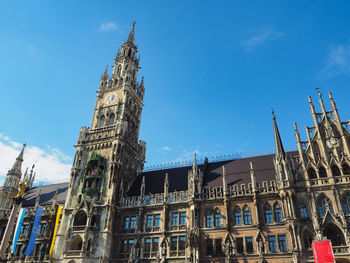Low angle view of historical building against blue sky