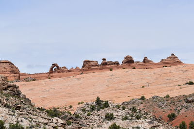 Low angle view of rock formations against sky