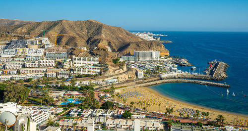 February 2 2022-panoramic landscape with puerto rico village resort and beach on gran canaria spain 