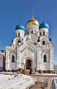 View of building against blue sky during winter