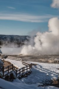 Scenic view of snow covered landscape against sky