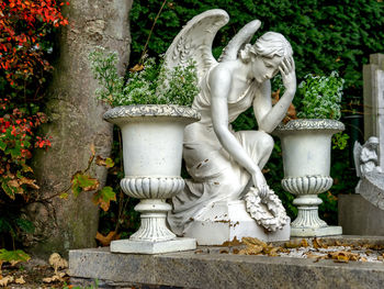 Close-up of angel statue in garden