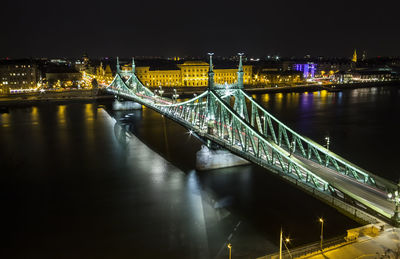 High angle view of illuminated liberty bridge over danube river at night