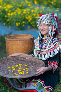 Portrait of a smiling young woman holding umbrella