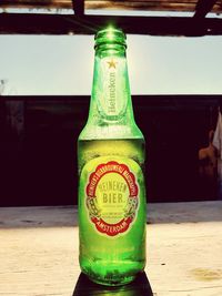 Close-up of beer glass bottle on table