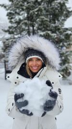 Portrait of young woman in warm clothes , snow,  winter time 