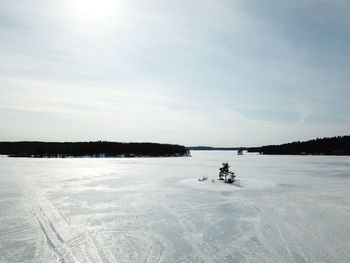 Scenic view of frozen lake against sky