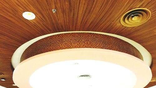 Low angle view of illuminated ceiling