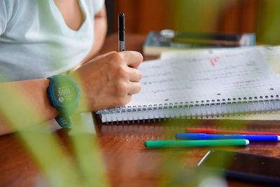 Close-up of woman reading book