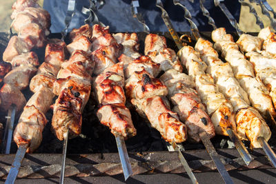 High angle view of meat on barbecue grill