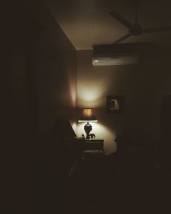 Man in illuminated room