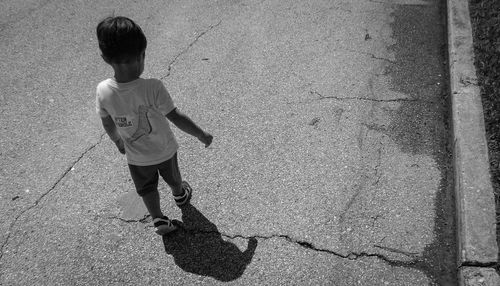 Boy walking on street