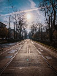 View of railroad tracks at sunset