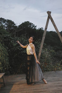 Full length of woman standing on field