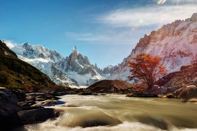 Scenic view of snowcapped mountains against sky