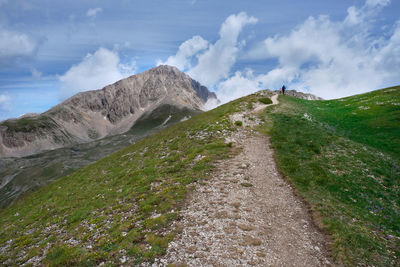 People walking on the path that leads to the duca degli abruzzi gran sasso refuge