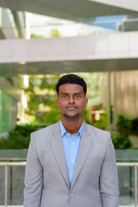 Portrait of young man standing outdoors