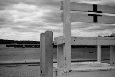 Plus sign on lifeguard chair at beach