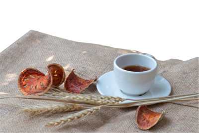 Close-up of coffee cup against white background