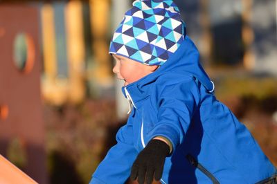 Side view of boy playing at park