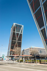 Low angle view of skyscraper against clear sky