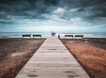 Scenic view of sea against cloudy sky