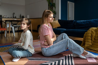 Portrait of mother and daughter at home