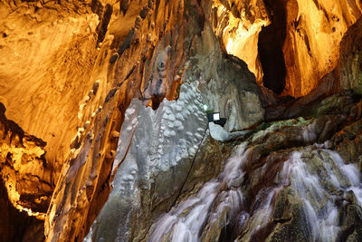 Waterfall at illuminated batu caves