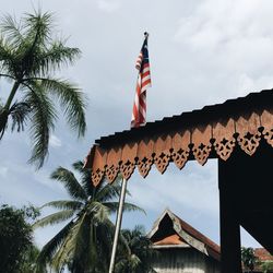 Low angle view of building against cloudy sky