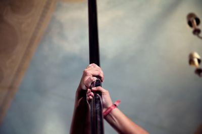 Close-up of hand holding pole