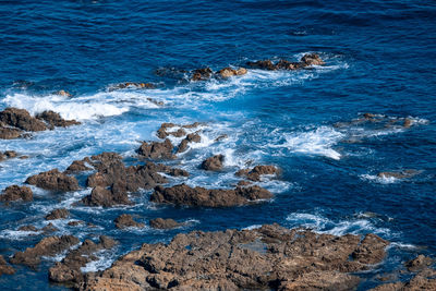 Scenic view of rocks in sea