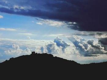 Low angle view of silhouette mountain against sky