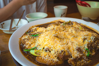 Cropped hand of person preparing food
