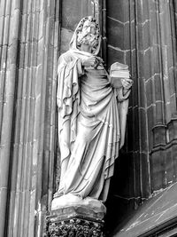 Low angle view of statue against temple